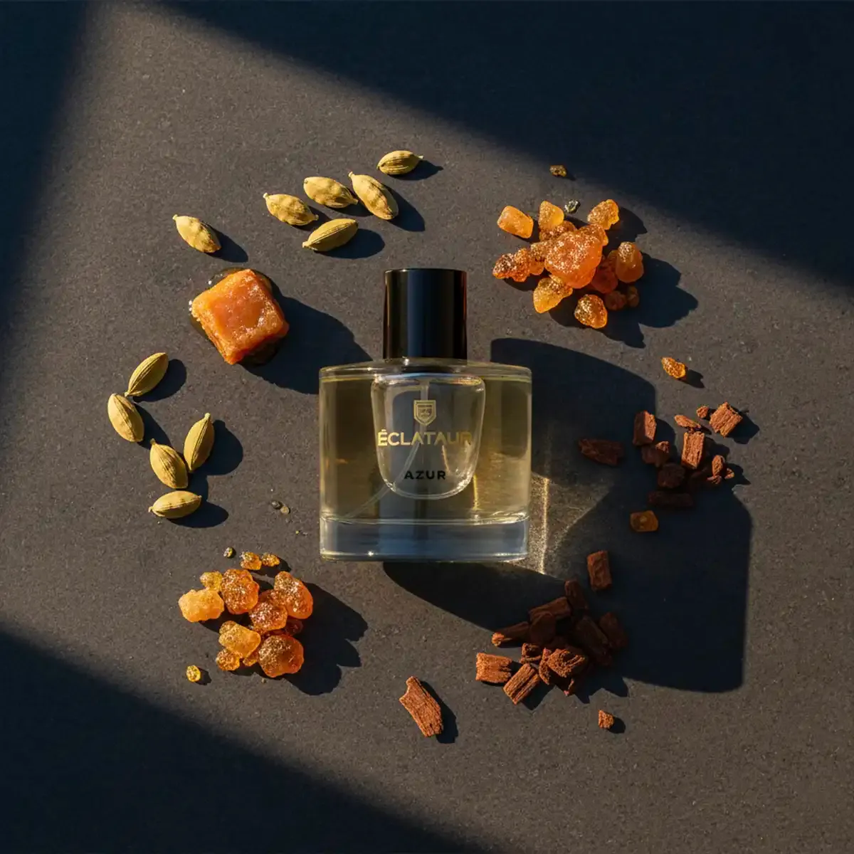 ÉCLATAUR AZUR perfume with cardamom bottle, matte black cap with gold detail