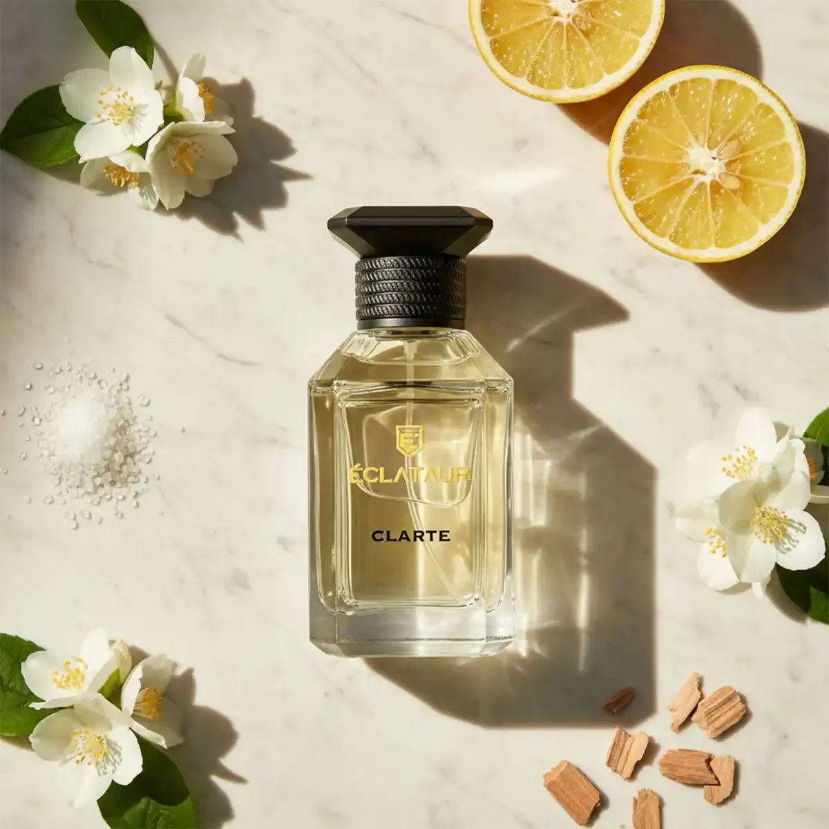 ÉCLATAUR CLARTÉ amber musk fragrance bottle, matte black cap with gold detail