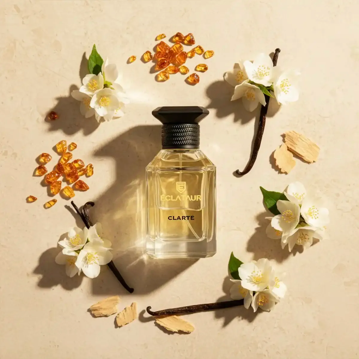 ÉCLATAUR CLARTÉ amber musk fragrance bottle, matte black cap with gold detail