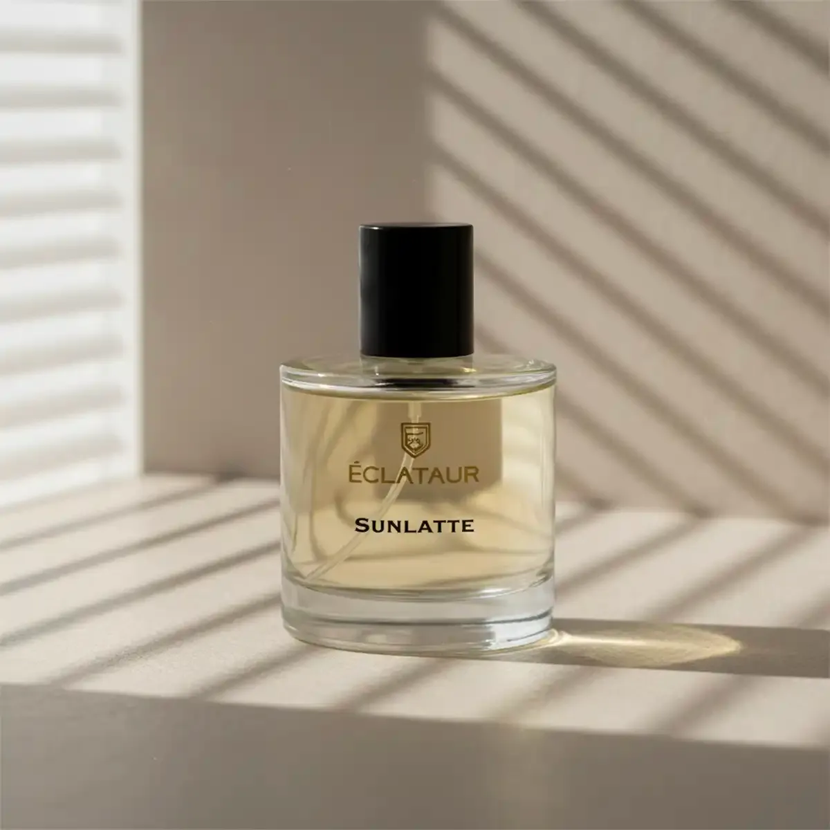 ÉCLATAUR SUNLATTE vanilla gourmand perfume bottle, matte black cap with gold detail