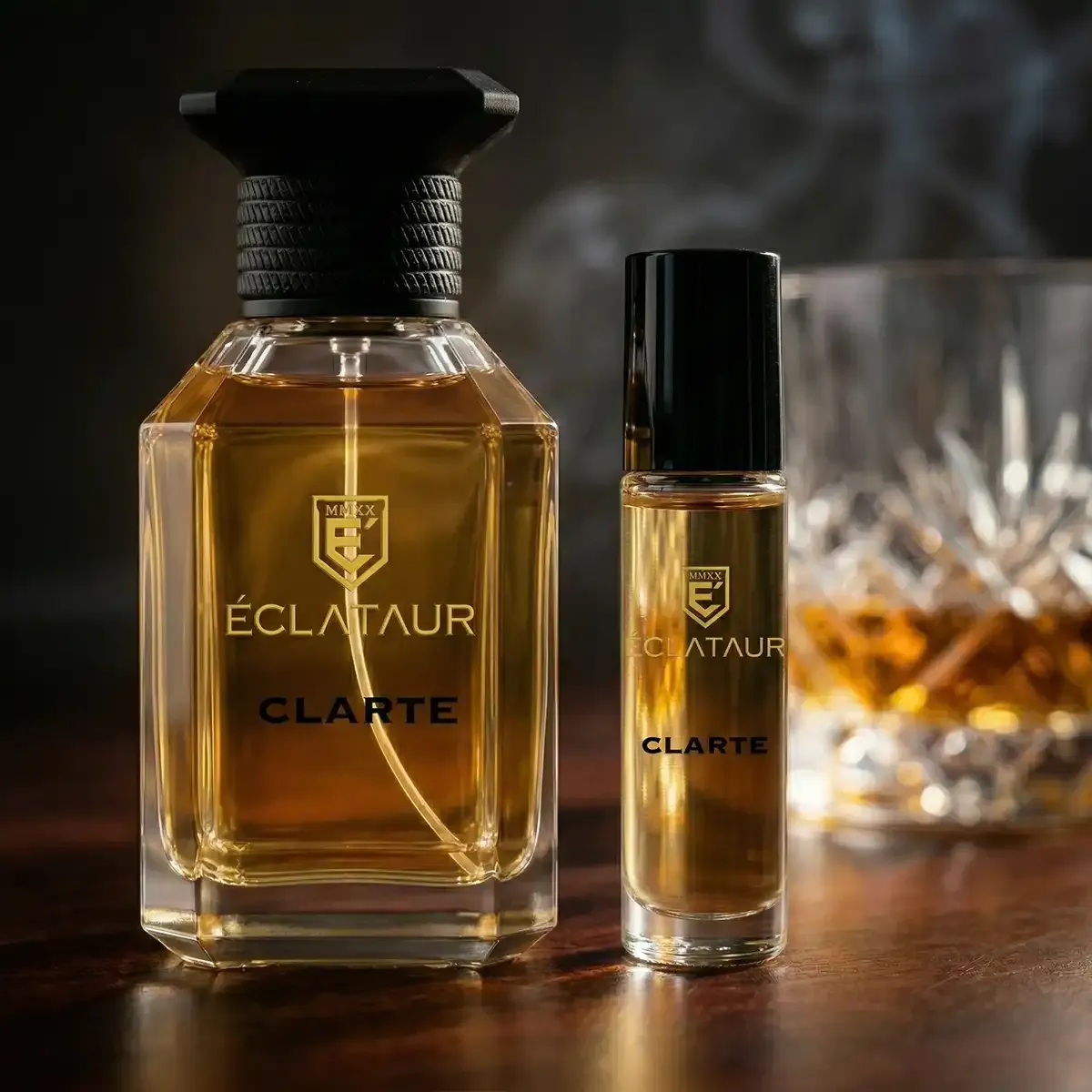 ÉCLATAUR CLARTÉ roll-on perfume oil beside the Eau de Parfum bottle